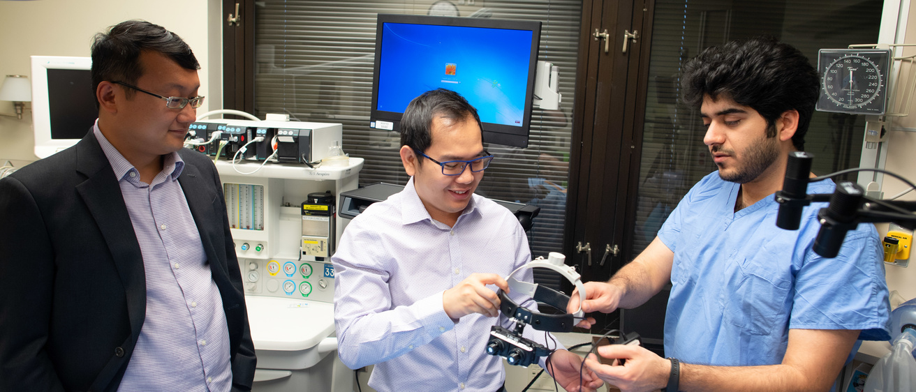 Researchers work with smart goggles in a lab